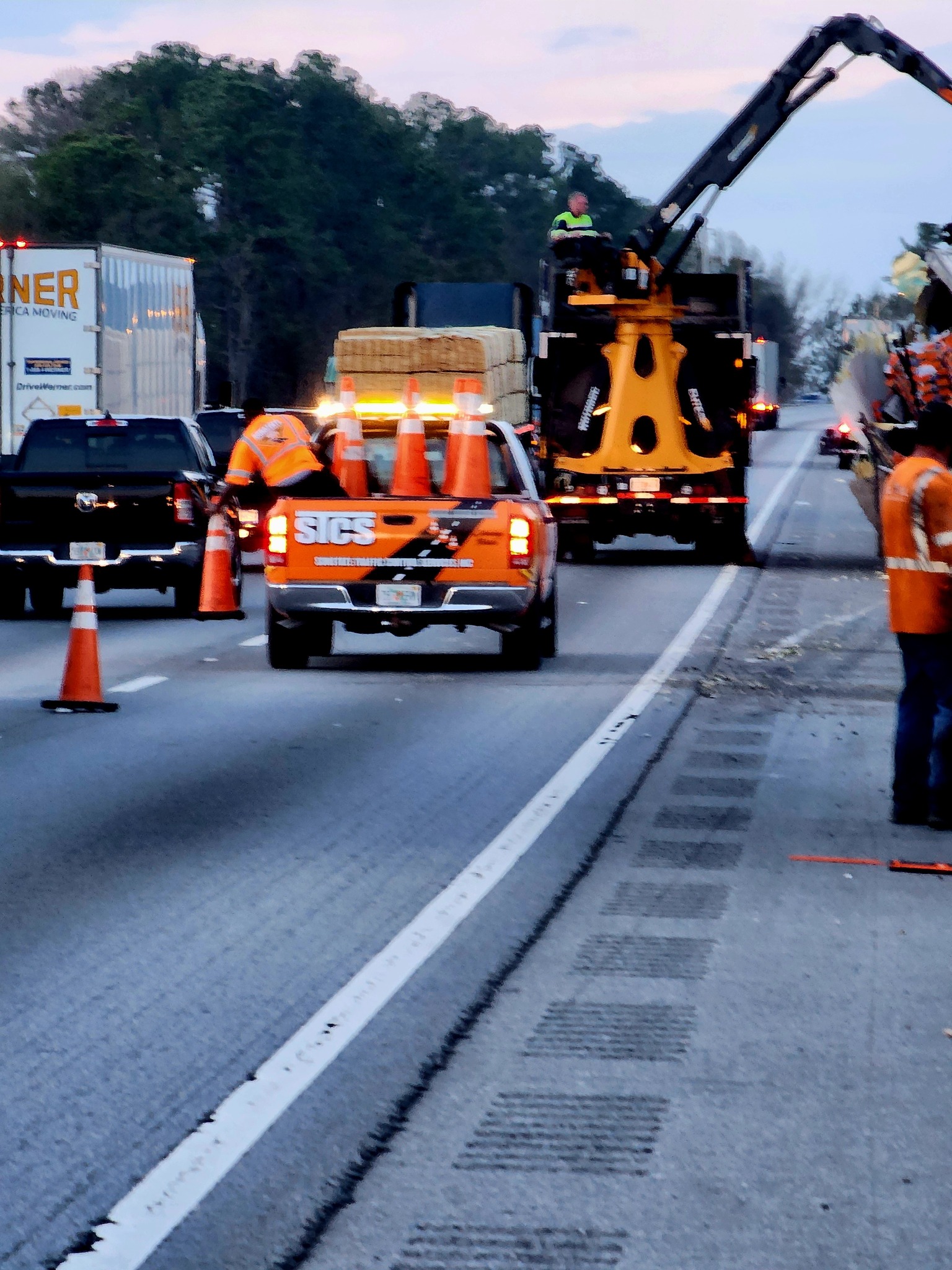 Sun State Traffic Control drums and barricades setup creating safe work zone in Florida
